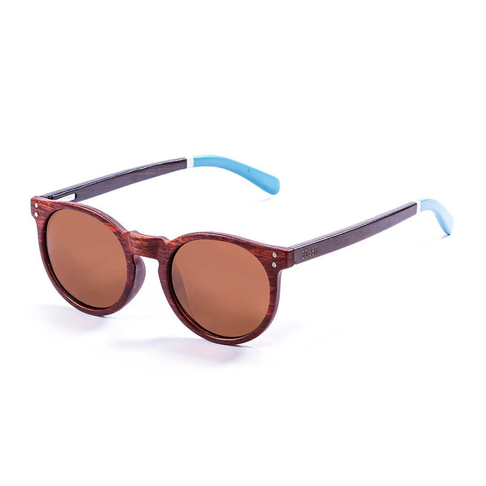 ocean sunglasses KRNglasses model LIZARD SKU 55012.5 with blue transparent frame and revo red lens